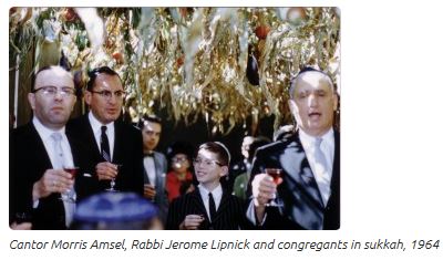 Cantor Morris Amsel, Rabbi Jerome Lipnick and congregants in sukkah, 1964